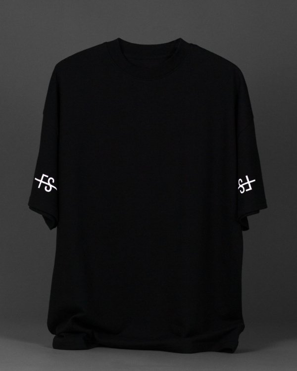 Black oversized cotton t-shirt with white sleeve logo.