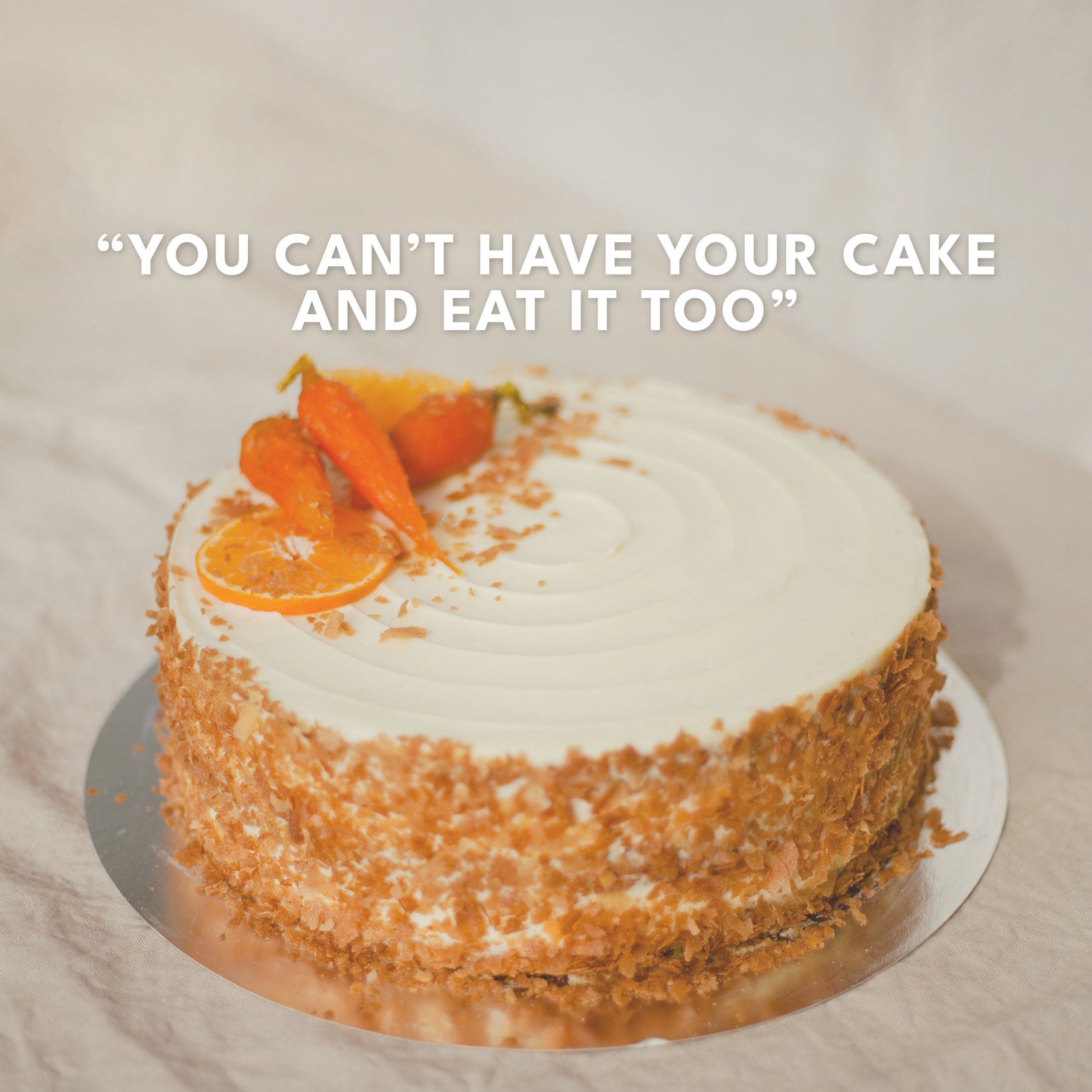 Photo of a cake with the following text written above it: "You can't have the cake and eat it too."